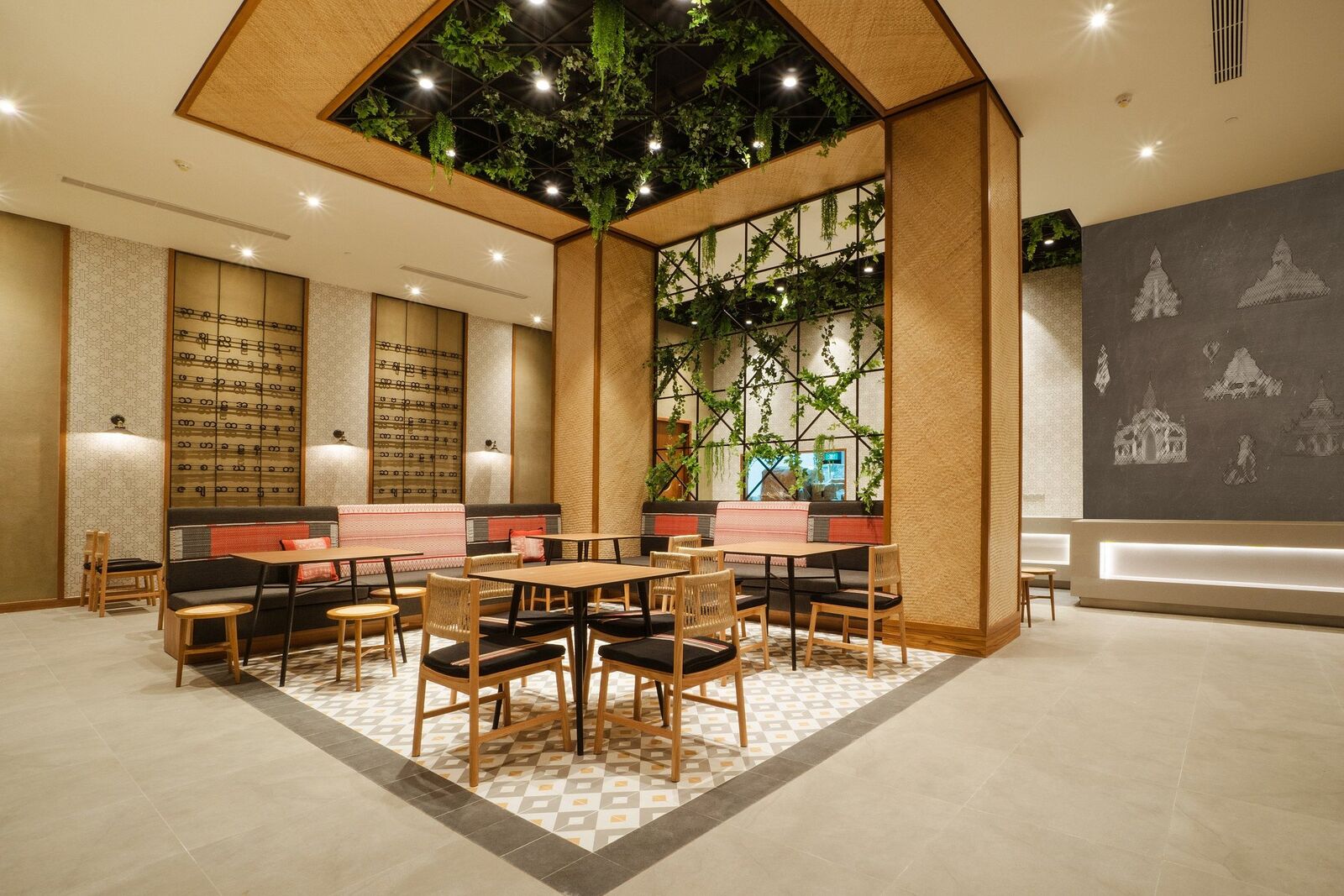 Dining room with a central table and a mural of pagodas